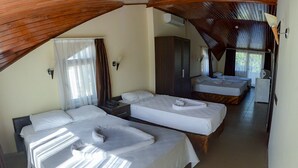 A room with two beds, a wardrobe, a desk, and a chair. - Green Palm Hotel (Marmaris)