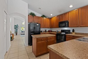 Fridge, microwave, oven, stovetop - Game Room plus Private Pool 4BR Disney Area (Kissimmee)