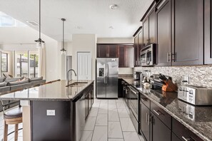Fridge, microwave, oven, stovetop - 5BR Themed Bedrooms at Storey Lake (Kissimmee)