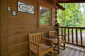 A wooden cabin with a sign reading "gather" and the number "2" on the wall. - View  Private Log Cabin  Fireplace  Hot tub  RELAX (Sevierville)