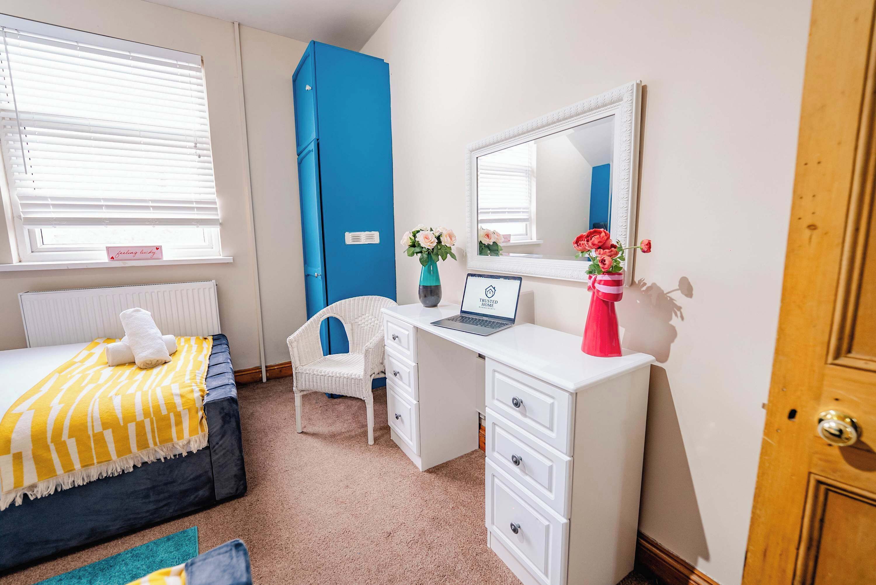 Twin Bedroom Desk Area : Dedicated workstation, vanity mirror, and comfortable seating , ideal for working remotely or getting ready with ease.