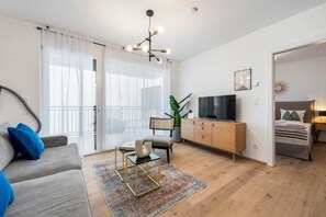 Apartamento superior, balcón, vistas al patio | Zona de estar