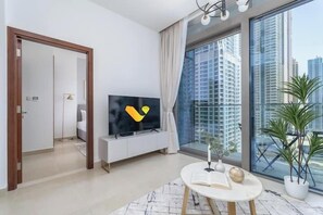 Apartment, Balcony, City View | Living area | 65-inch Smart TV with cable channels - Vogue | Marina Gate near JBR Beach | Marina Mall (Dubai)