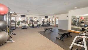 A gym with treadmills, elliptical machines, and free weights. - Bear Creek Lodge 209b 1 Bedroom Hotel Room (Telluride)