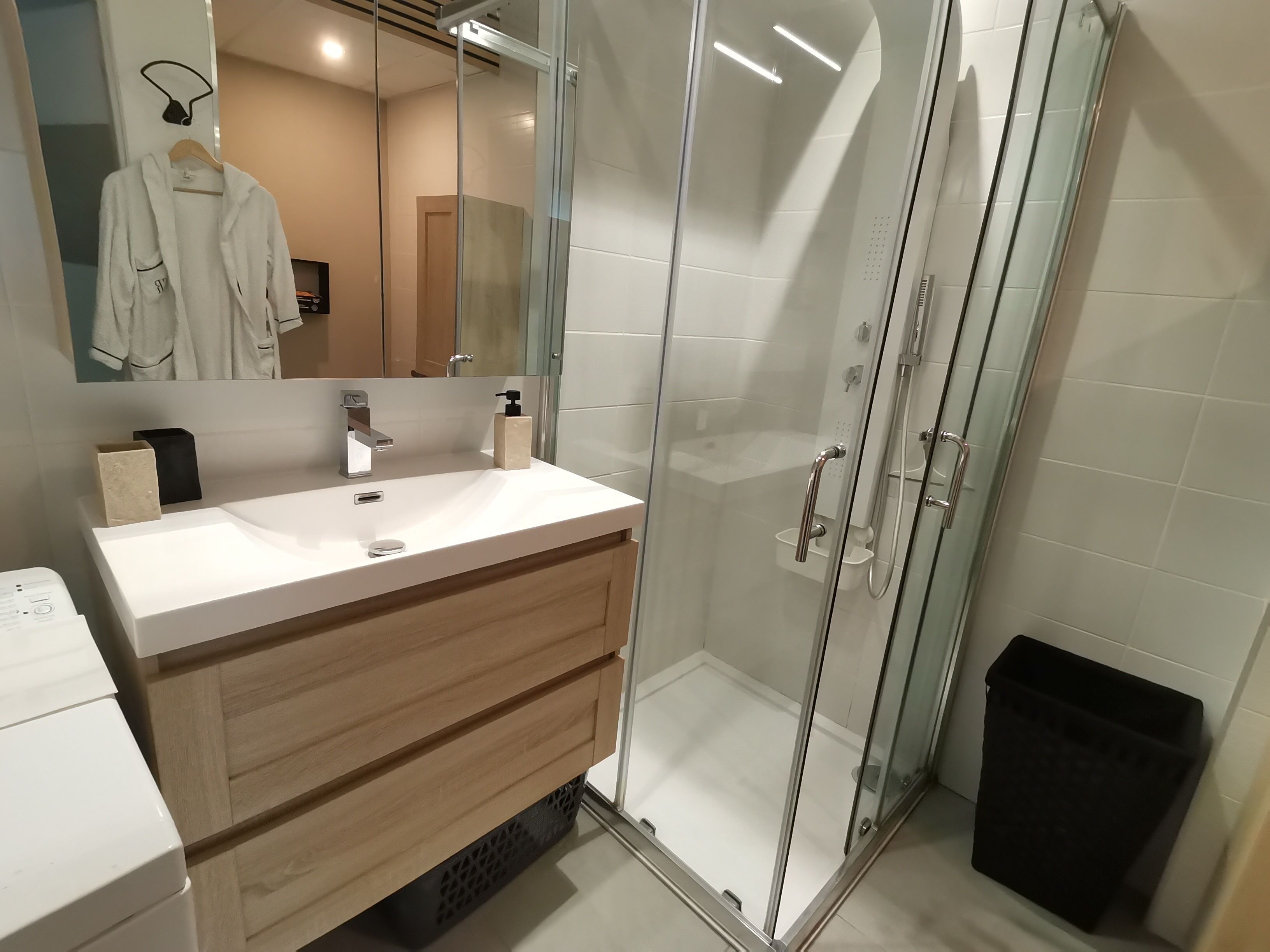 Shower, hair dryer, towels, toilet paper
