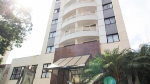A tall, modern building with multiple balconies, a central entrance with steps, and a sign that reads 'PALACE.' - The Palace Moema 501 (São Paulo)