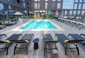 Outdoor pool, a heated pool - Family & Group Friendly • Boston Apartment Near MBTA • Easy Access to World Cup (Boston)
