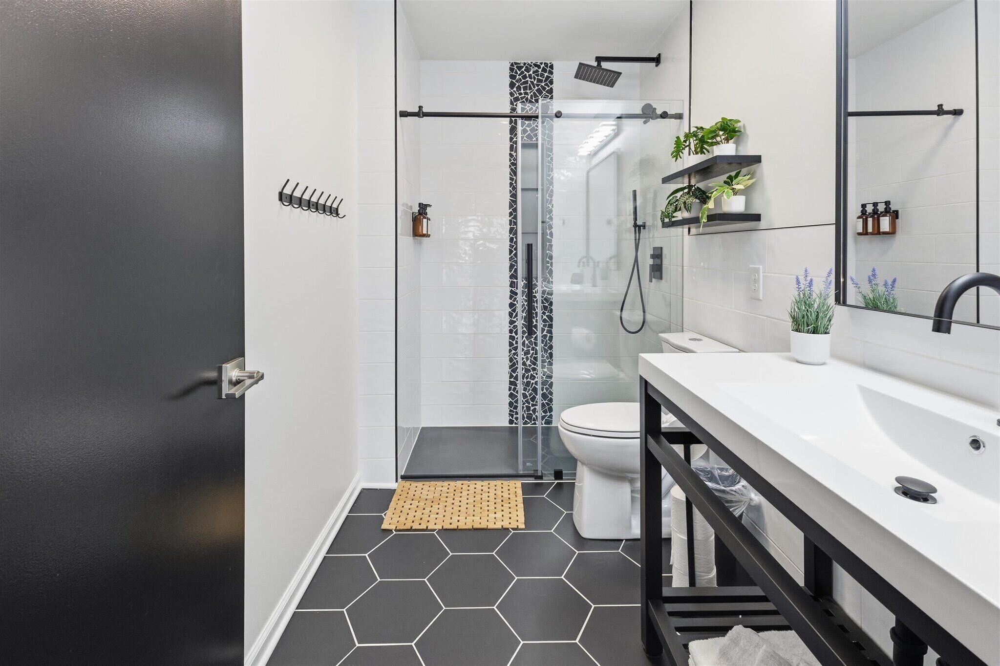 Shower, hair dryer, towels, shampoo