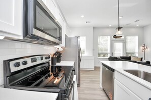 Microwave, oven, stovetop, dishwasher - Modern 2BR Townhome Near NRG • Med Center • Downtown w/ Garage (Houston)