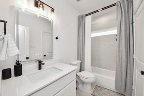 Hair dryer, towels, soap, shampoo - Modern 2BR Townhome Near NRG • Med Center • Downtown w/ Garage (Houston)