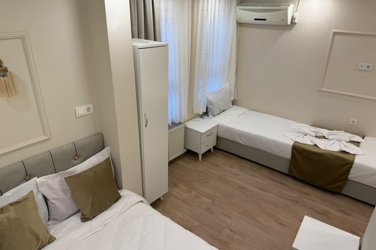 Family Quadruple Room, City View | Soundproofing, iron/ironing board, free WiFi