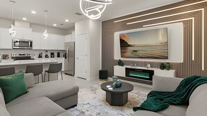 Ein modernes Wohnzimmer mit einer Couch, einem Couchtisch und einem an der Wand montierten Fernseher.