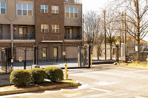 A multi-story building with a brick facade and multiple windows. - Fair and Walker - Unit 25 (Atlanta)
