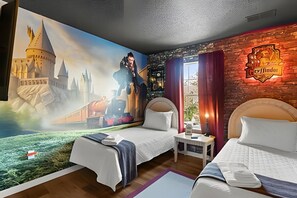 A hotel room with two beds, a mural of a castle, a Hogwarts sign, and a window with curtains. - 3 Bd / 2,5 Ba / Sleeps 08/ Terra Verde Resort (Kissimmee)