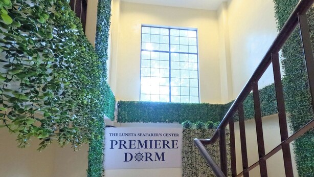 A staircase with a sign reading "The Luneta Seafarer's Center Premiere Dorm". - The Luneta Seafarers Center Premier Dorm (Manila)