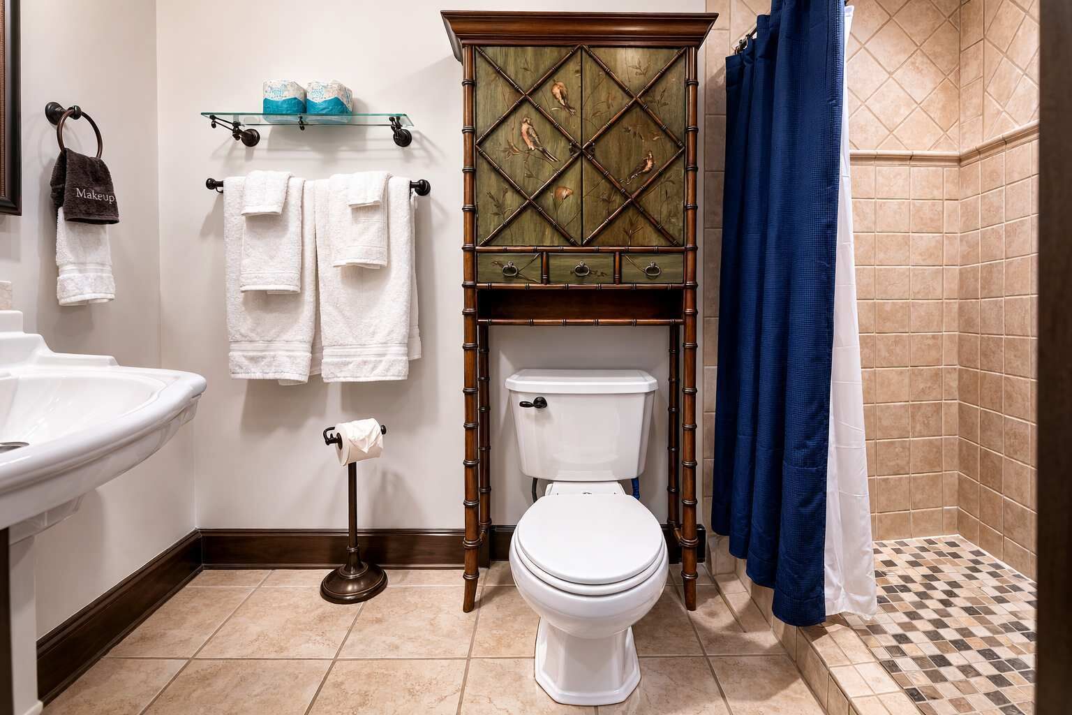 A bathroom with a toilet, sink, and shower curtain.