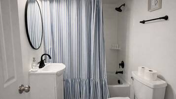 Shower, hair dryer, towels, shampoo