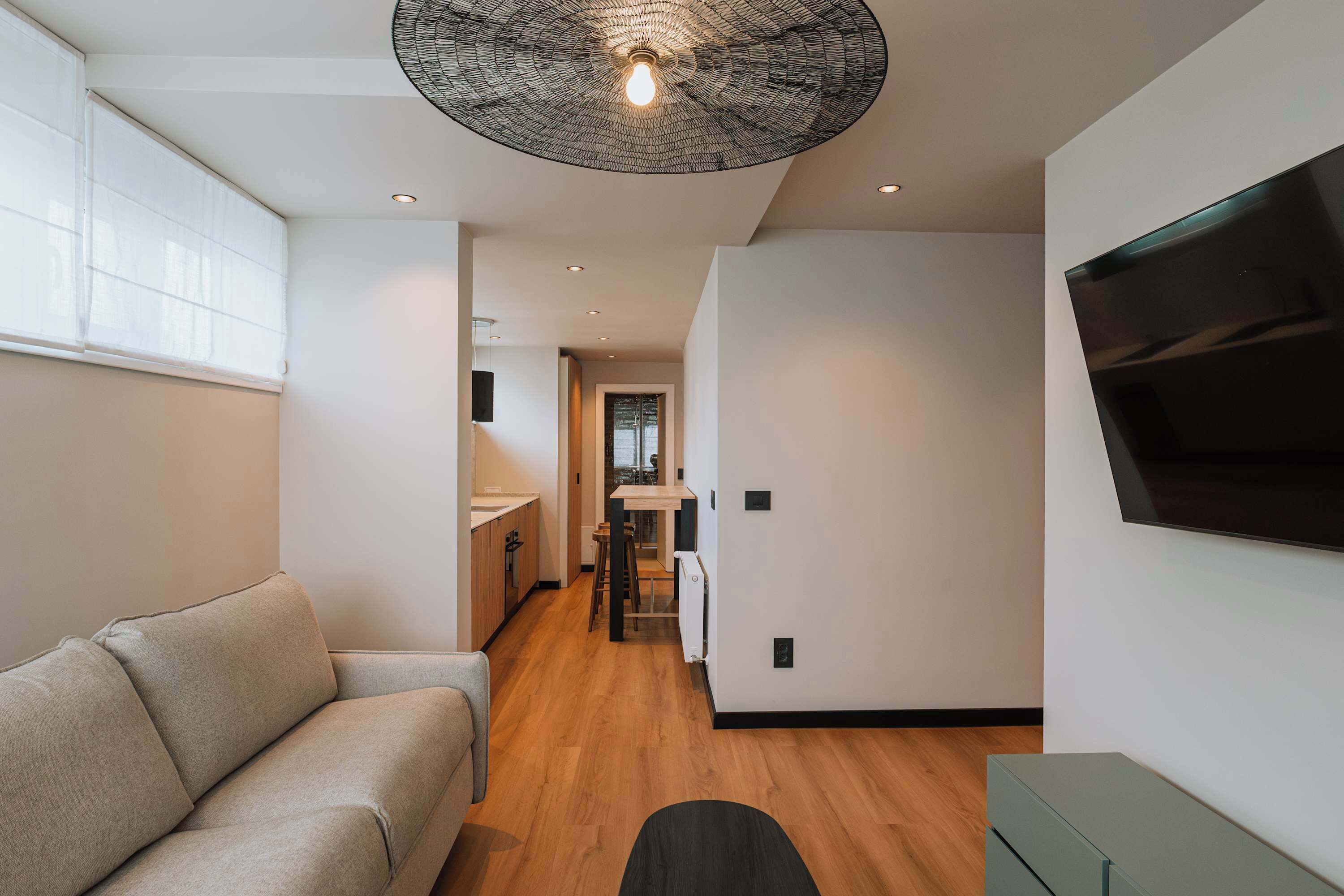 Apartment | Living area | 60-inch TV with cable channels