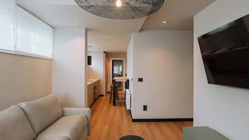Apartment | Living area | 60-inch TV with cable channels