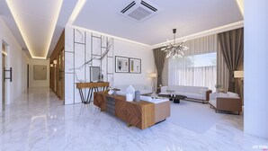 Una sala de estar moderna con piso de mármol, una consola de madera, un sofá y una mesa de centro.