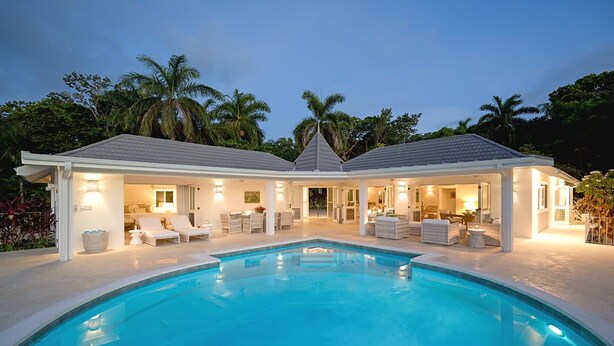 A poolside area with a swimming pool, lounge chairs, and a covered seating area. - Tranquil 4BR Villa Pool Spa Resort Access (Montego Bay)