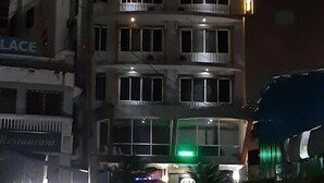 A multi-story building with illuminated windows and a sign that reads "LACE". - Bridge Hotel Mombasa (Mombasa)