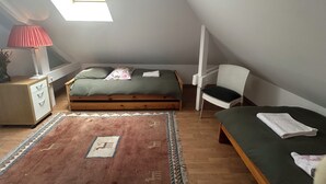 A bedroom with a bed, a chair, a desk, a lamp, and a window. - Lavender room with twin beds, long Zen infrared heating and softness (Étaples)