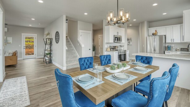 A modern kitchen with white cabinets, stainless steel appliances, and a central island. - Beautiful 3 bedroom house with views of the hills. (Salem)