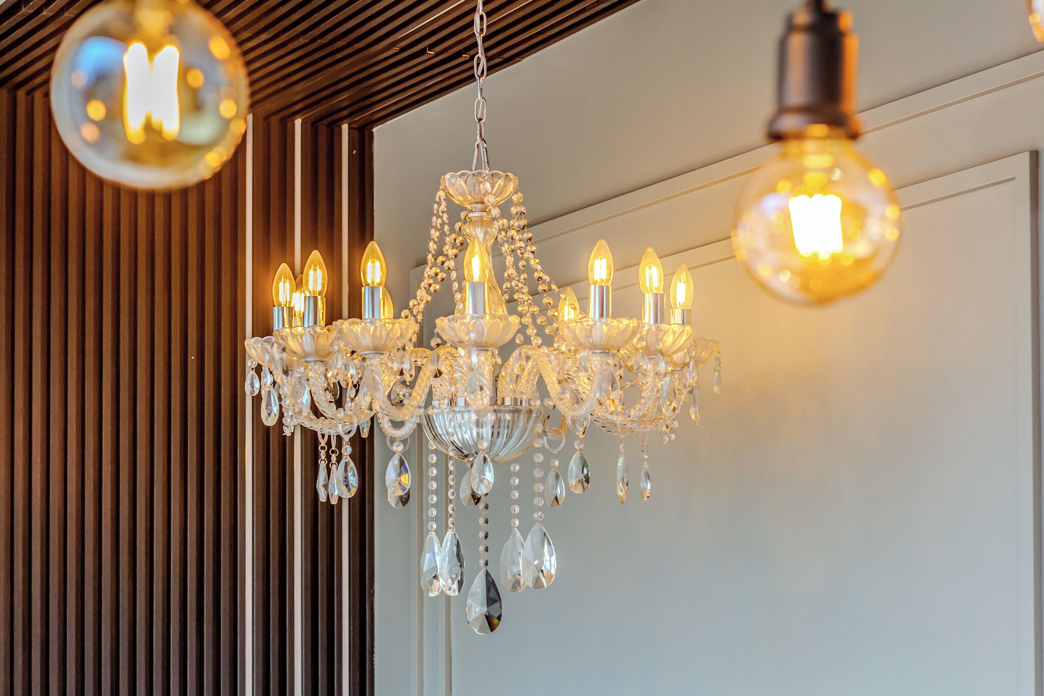 A chandelier with multiple bulbs and crystal decorations.