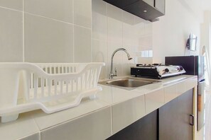 Standard Studio | Private kitchen - Comfy And Modern Studio At Bale Hinggil Apartment (Surabaya)