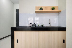 Standard Studio | Private kitchen - Strategic And Neat Studio At Nifarro Park Apartment (Jakarta)