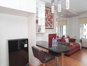 Dining room - Serene Red Vibe 2Br At Apartment Nifarro Park (Jakarta)