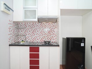 Interior - Serene Red Vibe 2Br At Apartment Nifarro Park (Jakarta)