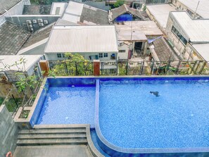 Pool - Serene Red Vibe 2Br At Apartment Nifarro Park (Jakarta)