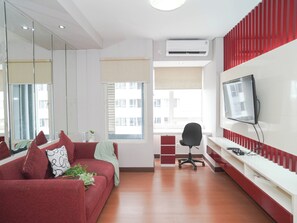 Living room - Serene Red Vibe 2Br At Apartment Nifarro Park (Jakarta)