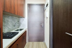Standard Studio | Private kitchen - Wooden Accents Studio For 2 Pax At Pacific Garden Campus Town Apartment (Tangerang)