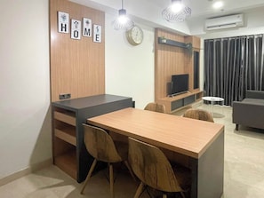 Standard Apartment | Dining room - Wooden Accents 1Br At Podomoro City Deli Medan Apartment (Medan)