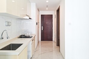 Standard Apartment | Private kitchen - Neat 2Br For 3 Pax At Sky House Bsd Apartment (Pagedangan)
