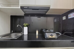 Standard Studio | Private kitchen - Serene Studio With City View At Springlake Summarecon Bekasi Apartment (Bekasi)