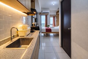 Standard Studio | Private kitchen - Tranquil Studio At Tamansari Prospero Sidoarjo Apartment (Sidoarjo)