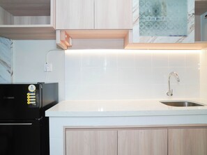 Standard Studio | Private kitchen | Electric kettle - Cozy And Tidy Living Studio At Apartment Tokyo Riverside Pik 2 (Teluknaga)