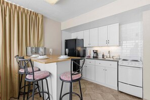 Condo, Multiple Beds, Balcony (Hawaiian Inn 502) | Private kitchen | Dining tables - Hawaiian Inn 502 (Daytona Beach Shores)