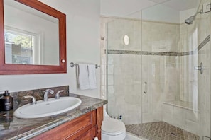 Shower, hair dryer, towels, shampoo