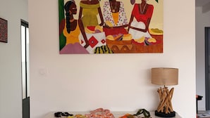 A room with a desk, two chairs, a painting, and a lamp. - L'ARS DE VIVRE – Exceptional Home in Ars-en-Ré | Pool | Sleeps 10 (Ars-en-Ré)