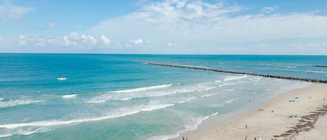 On the beach, sun loungers, beach towels