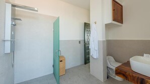 A bathroom with a shower, toilet, and sink. - La Casa Blanca (Puerto Vallarta)