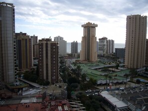 A high-rise urban area with multiple buildings, including a prominent tower with a unique top structure. - Gemelos 2 11e2 in Benidorm (Benidorm)