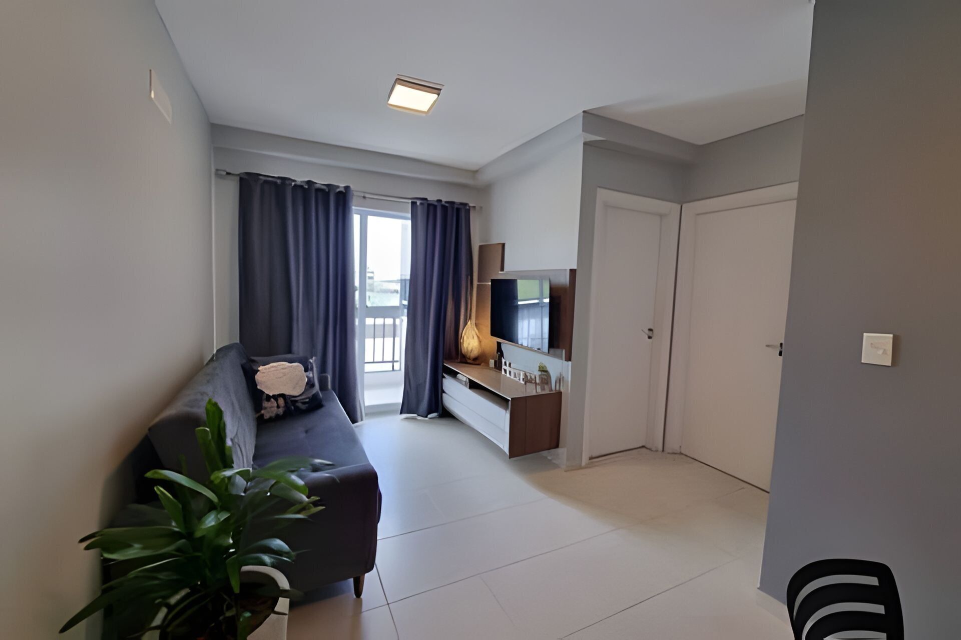 Apartamento básico | Área de estar | TV