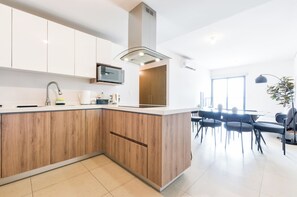 Family Suite, City View | Private kitchen