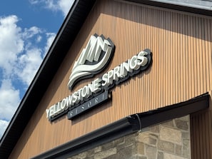 A building with a sign reading 'Yellowstone Springs Resort.' - Yellowstone Springs Resort (Island Park)